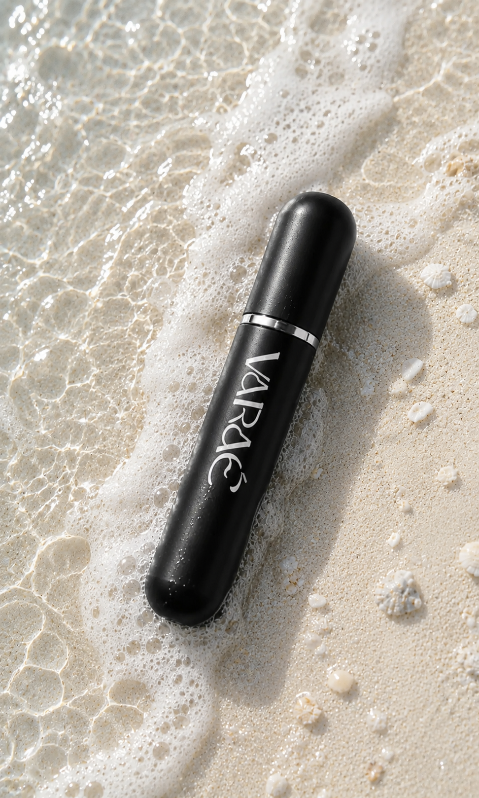 Noir Black · VARAÉ ANCHOR inhaler in matte black on wet sand, top view