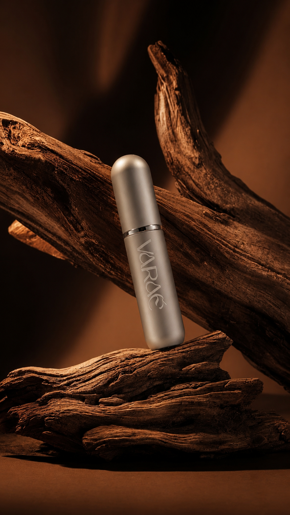 Silver Haze · VARAÉ ANCHOR inhaler in brushed silver, resting on driftwood