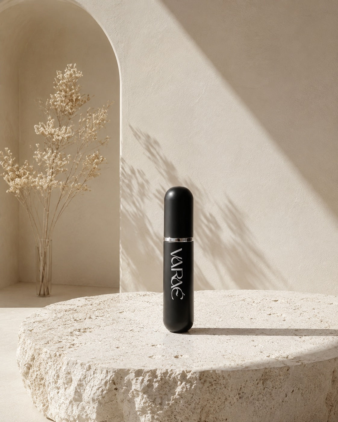 Noir Black · VARAÉ ANCHOR Ayurvedic nasal inhaler in matte black, standing on stone