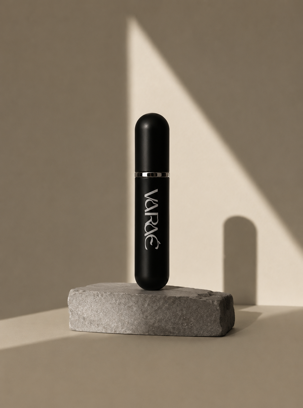 VARAÉ ANCHOR in Noir Black, standing on stone in warm light